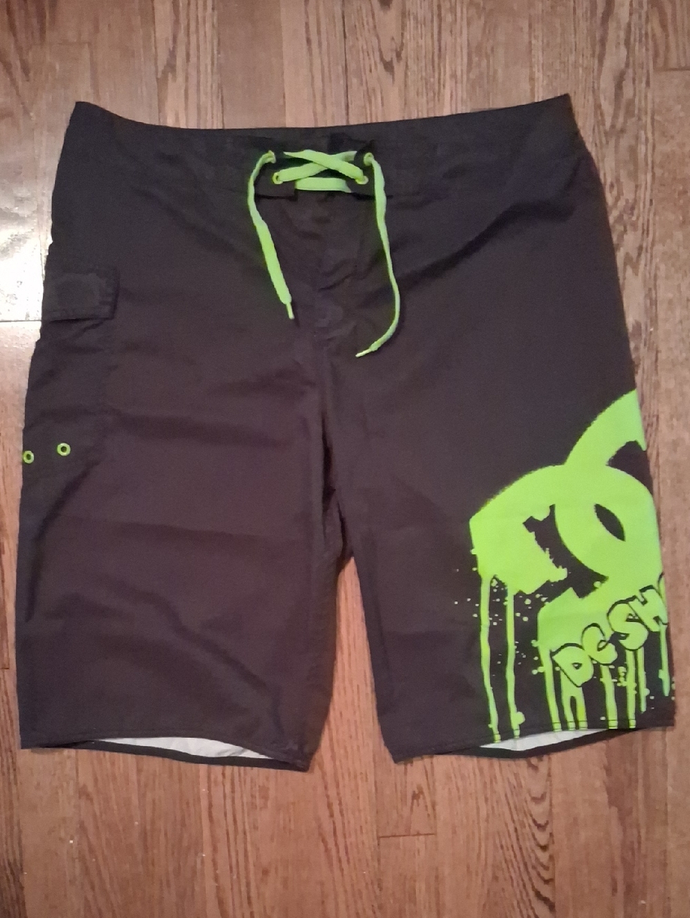 DC Men's Black Board Shorts with Neon Green Logo
